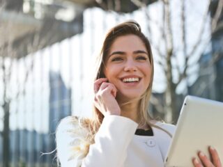 Featured: An Office Lady In White Blazer Holding Tablet Computer